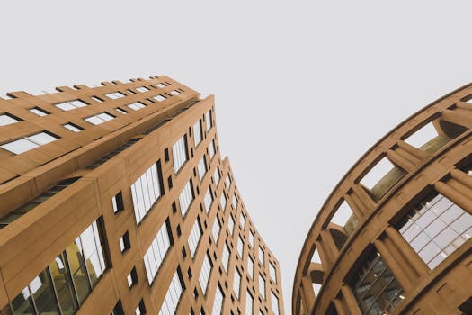 Low-angle shot of the distinctive modern architecture of Vancouver Public Library's facade against a gray sky.